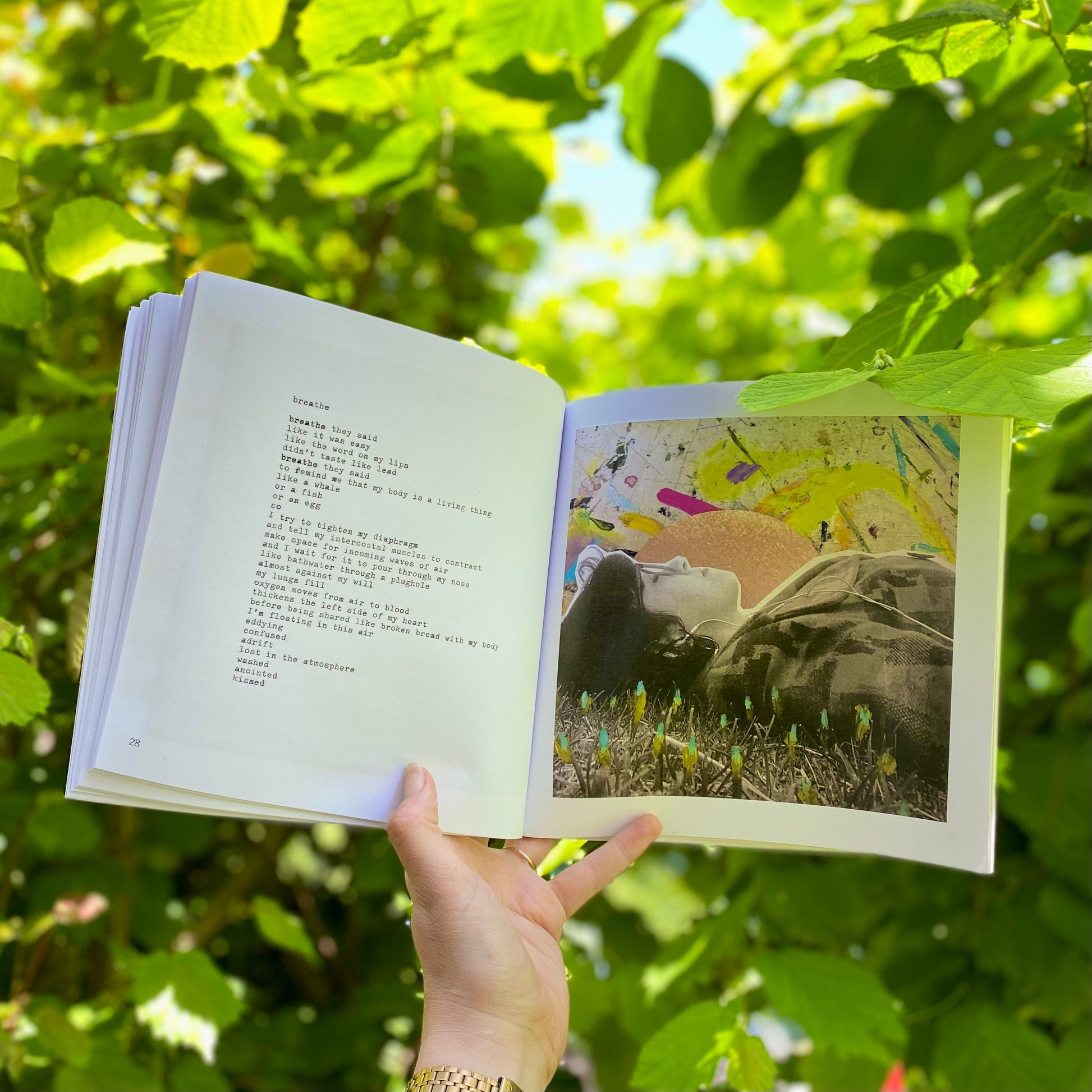 woman's hand holding The Quiet Woman book open on a page showing the poem Breathe alongside the accompanying painting